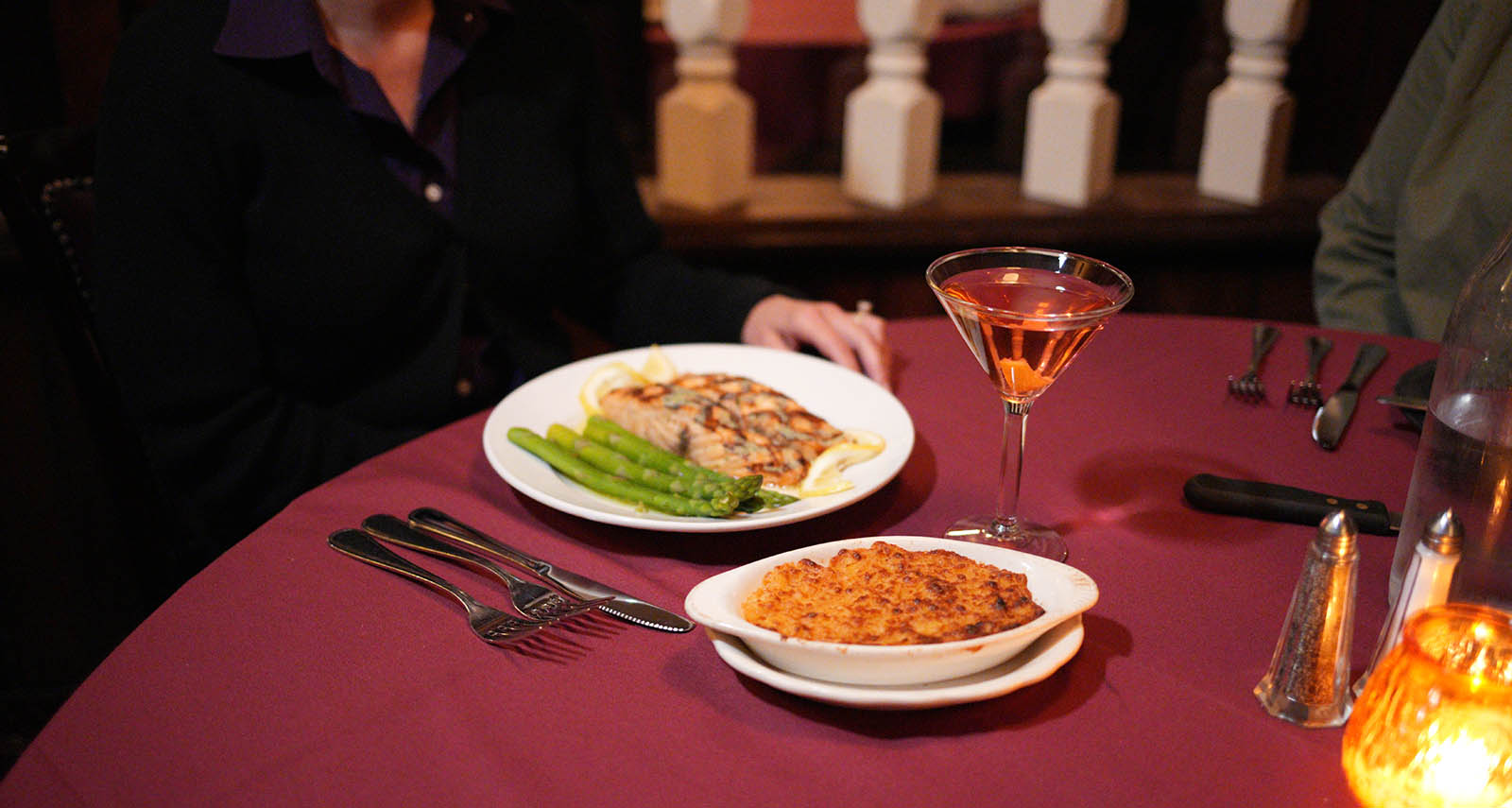 plated salmon with asparagus, with twice baked potatoes and a martini