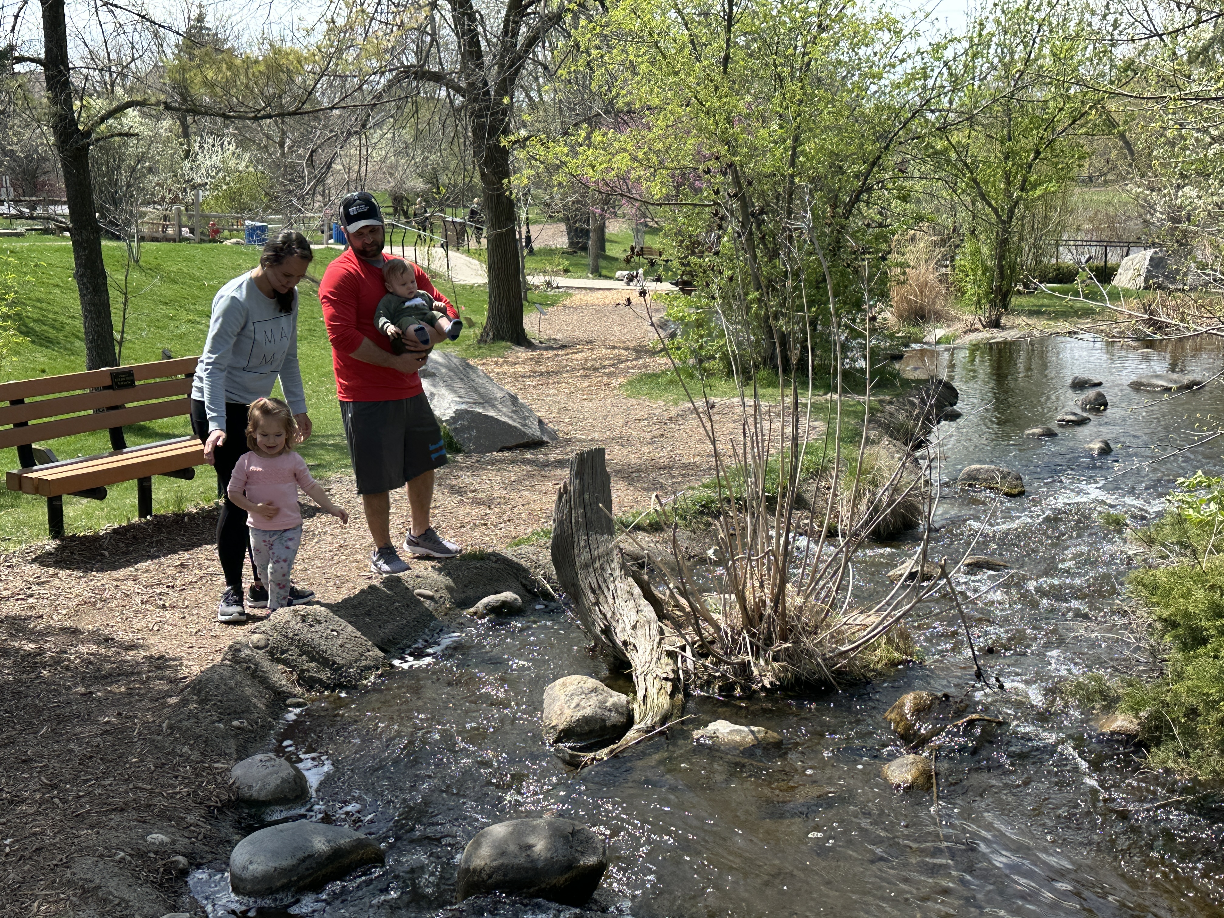 family of four by a waterfall