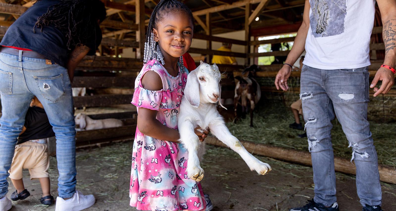 girl holding a goat - 