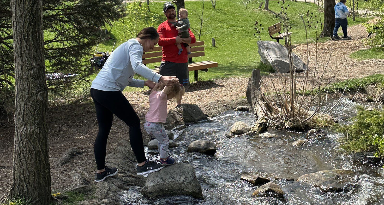 family of four at waterfall